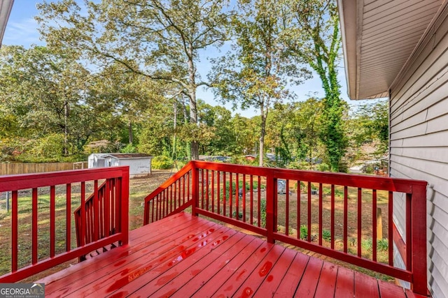 wooden deck featuring a storage shed