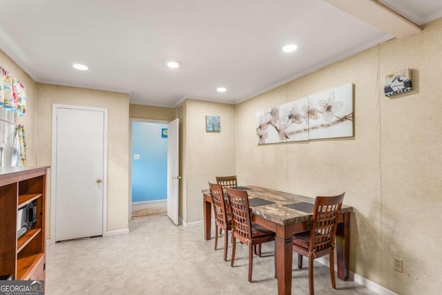 dining area with crown molding