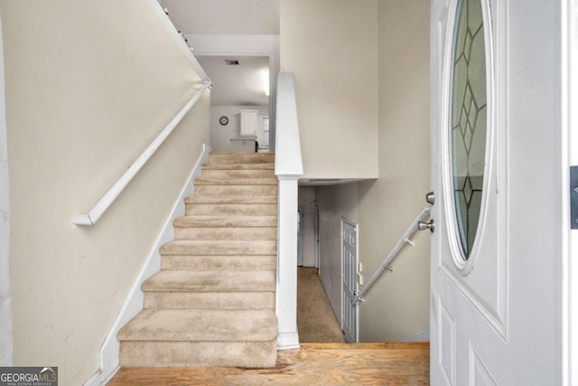 stairway with wood-type flooring