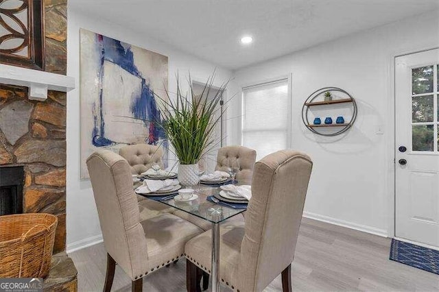 dining space featuring wood-type flooring