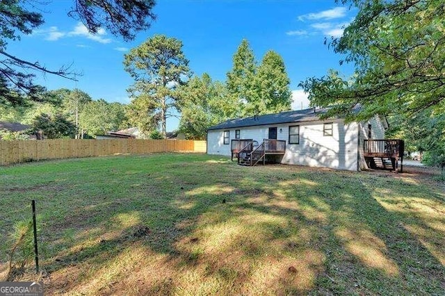 view of yard featuring a deck