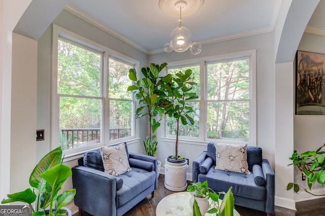 living room with dark wood-type flooring and crown molding