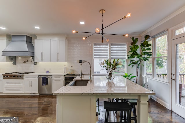 kitchen featuring white cabinetry, light stone countertops, sink, and custom range hood