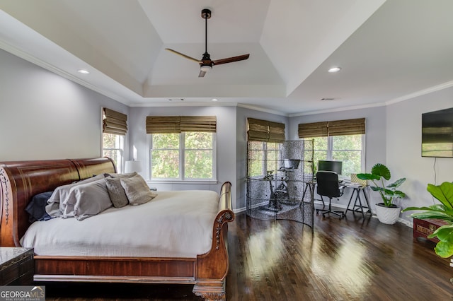 bedroom featuring dark wood-type flooring, ceiling fan, multiple windows, and ornamental molding