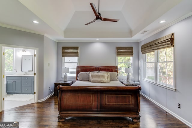 bedroom with ensuite bathroom, ceiling fan, dark hardwood / wood-style floors, crown molding, and vaulted ceiling