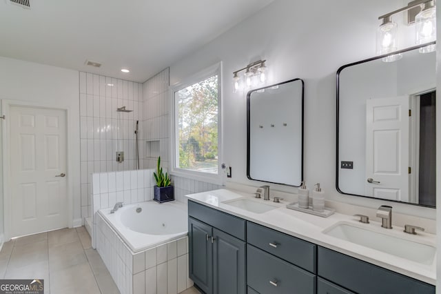 bathroom with vanity, tile patterned floors, and separate shower and tub