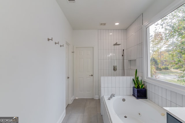 bathroom featuring vanity, tile patterned floors, and plus walk in shower