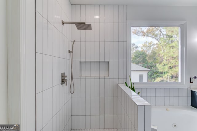 bathroom with independent shower and bath and a healthy amount of sunlight