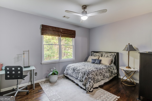 bedroom featuring ceiling fan and dark hardwood / wood-style flooring