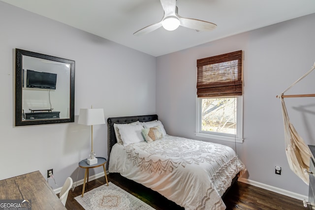 bedroom with ceiling fan and dark hardwood / wood-style floors