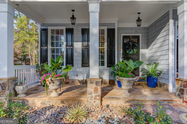 entrance to property featuring a porch