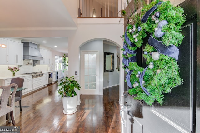 entrance foyer featuring dark hardwood / wood-style floors and ornamental molding