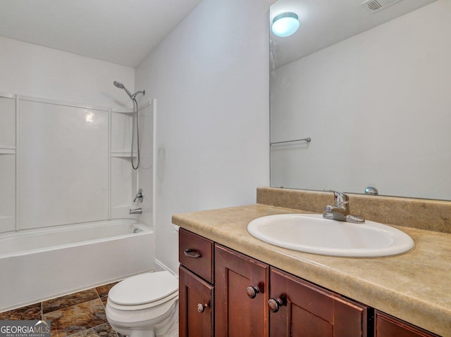 full bathroom featuring toilet, vanity, and  shower combination