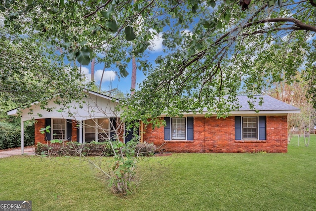 single story home with a front yard