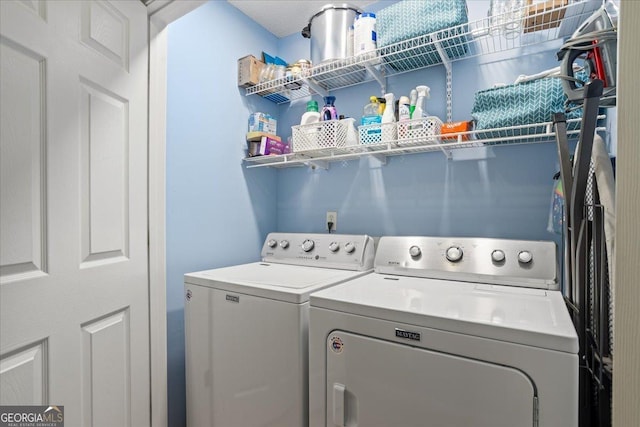 laundry area with washing machine and dryer