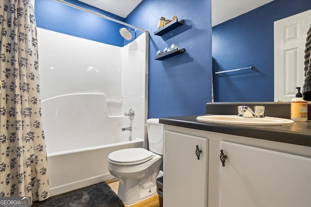 full bathroom featuring vanity, shower / bath combination with curtain, and toilet