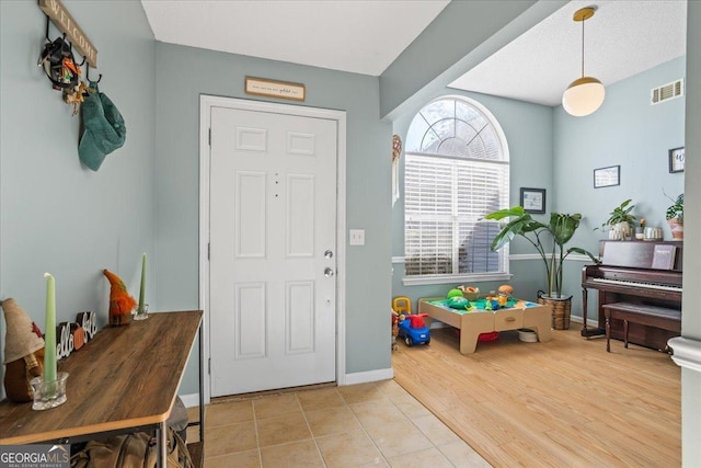 entryway with light hardwood / wood-style floors