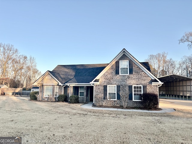 view of front of property featuring a carport