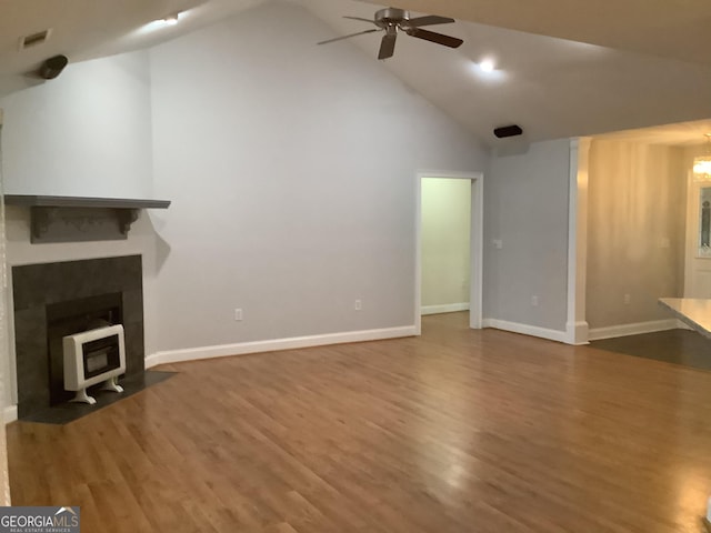 unfurnished living room with ceiling fan, wood-type flooring, and high vaulted ceiling