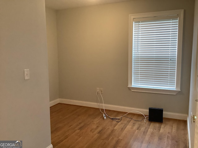 unfurnished room with light hardwood / wood-style flooring