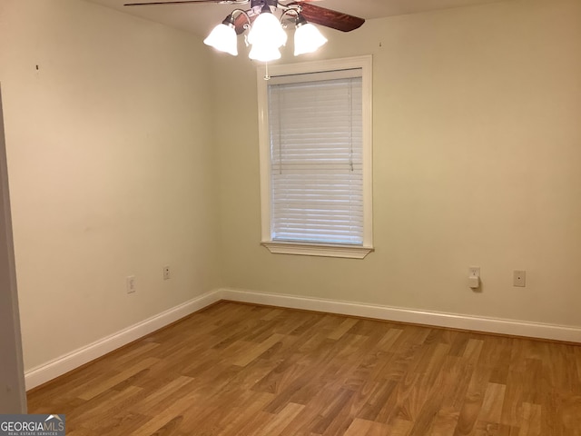 empty room featuring ceiling fan and wood-type flooring