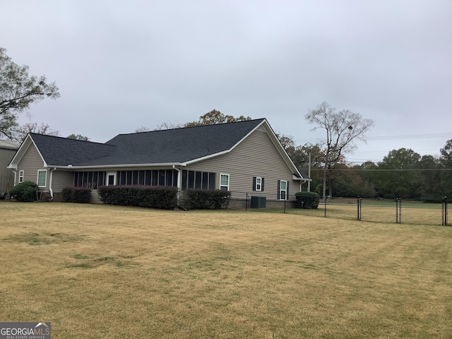 view of side of home featuring a lawn