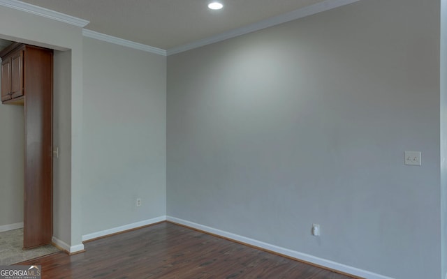 unfurnished room featuring wood-type flooring and crown molding