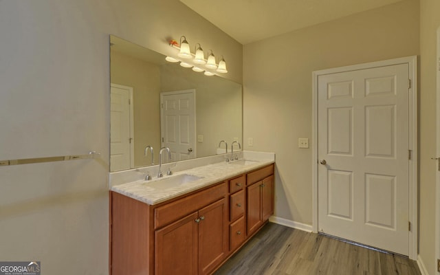 bathroom featuring hardwood / wood-style flooring and vanity