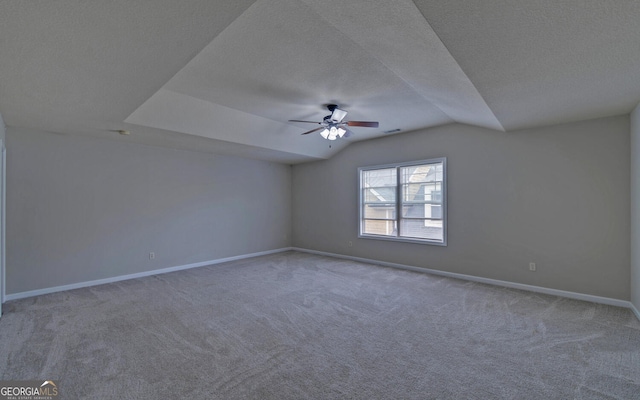 empty room featuring carpet, a textured ceiling, and ceiling fan