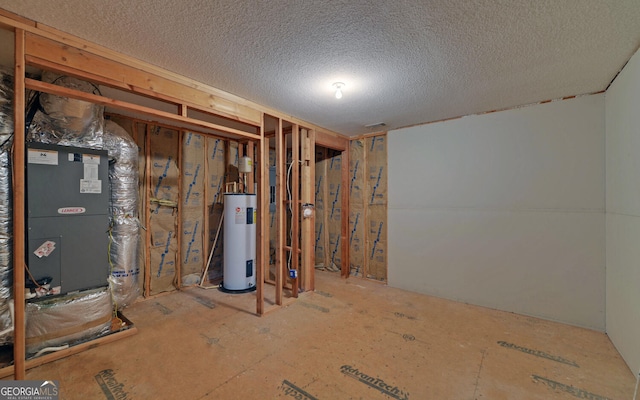 basement featuring water heater, a textured ceiling, and heating unit