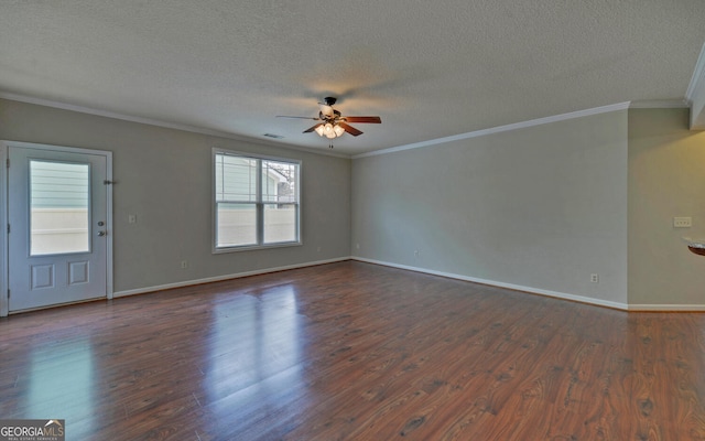 spare room featuring dark hardwood / wood-style flooring and a textured ceiling