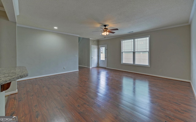 unfurnished living room featuring dark wood-type flooring, ceiling fan, a textured ceiling, and crown molding