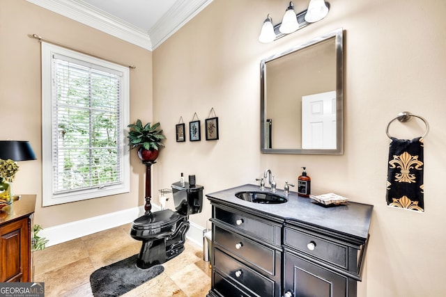 bathroom featuring toilet, vanity, and ornamental molding