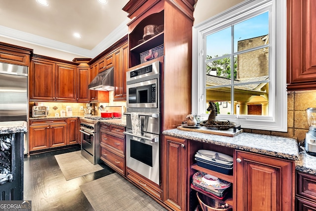 kitchen featuring high quality appliances, crown molding, backsplash, and dark hardwood / wood-style floors