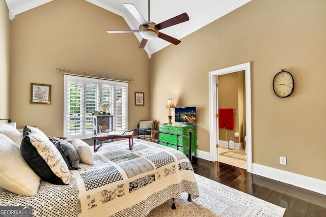 bedroom featuring ceiling fan, ensuite bathroom, dark hardwood / wood-style floors, and crown molding