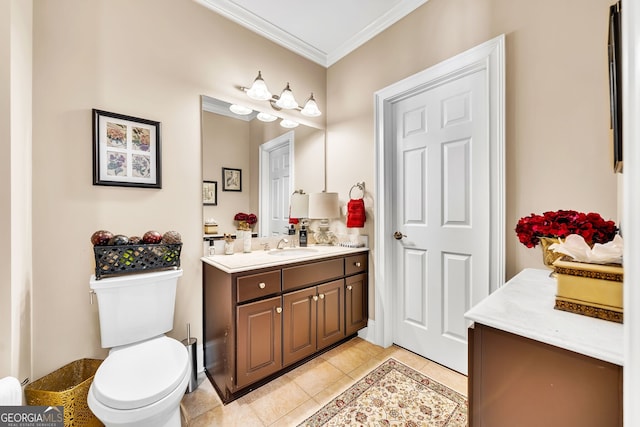 bathroom featuring toilet, tile patterned flooring, vanity, and crown molding