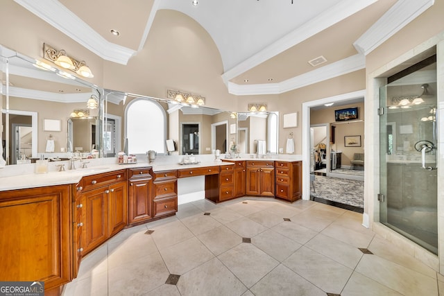 bathroom with tile patterned flooring, vanity, and crown molding