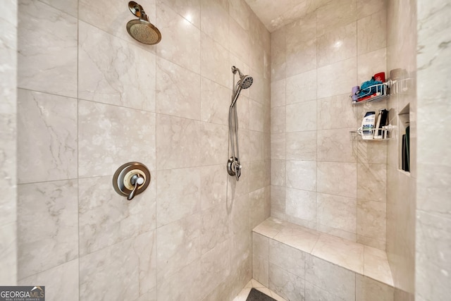 bathroom with a tile shower