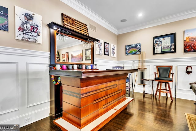 bar featuring dark wood-type flooring and crown molding