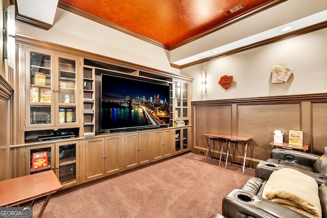 carpeted cinema room featuring ornamental molding