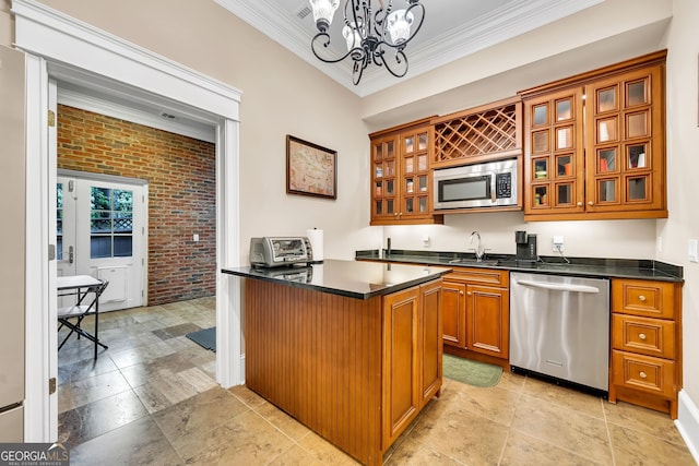 kitchen with ornamental molding, stainless steel appliances, decorative light fixtures, a chandelier, and brick wall