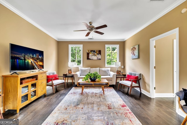 living room with dark wood-type flooring, ceiling fan, and crown molding