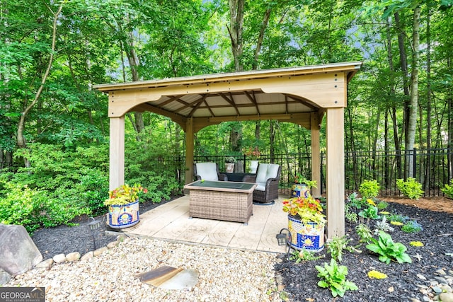 view of patio featuring a gazebo and an outdoor living space