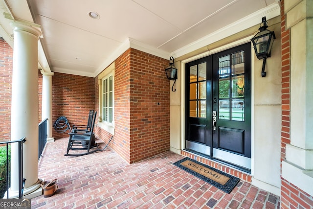 property entrance with french doors and a porch