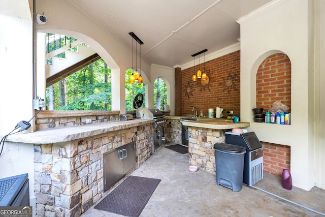 view of patio featuring grilling area, area for grilling, and sink