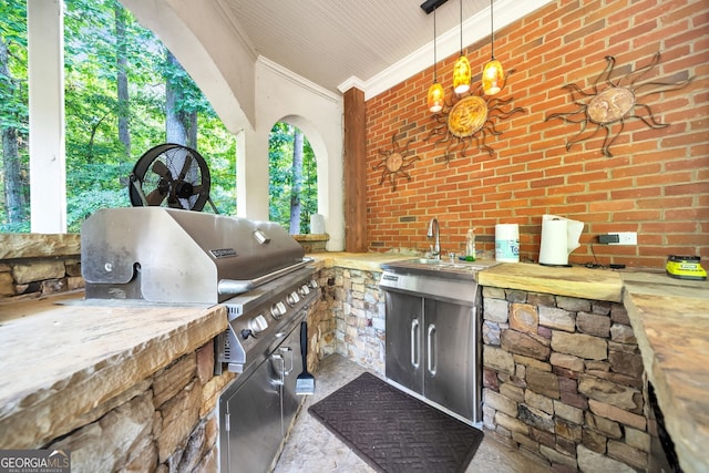 view of patio / terrace featuring area for grilling and sink