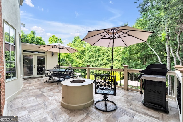 view of patio featuring french doors and an outdoor fire pit