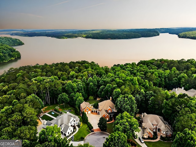 aerial view at dusk with a water view