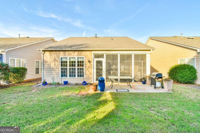 back of property featuring a patio, a sunroom, and a lawn