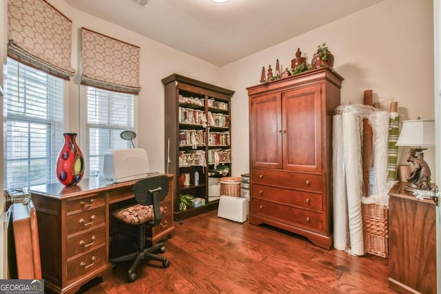 office space with dark wood-type flooring